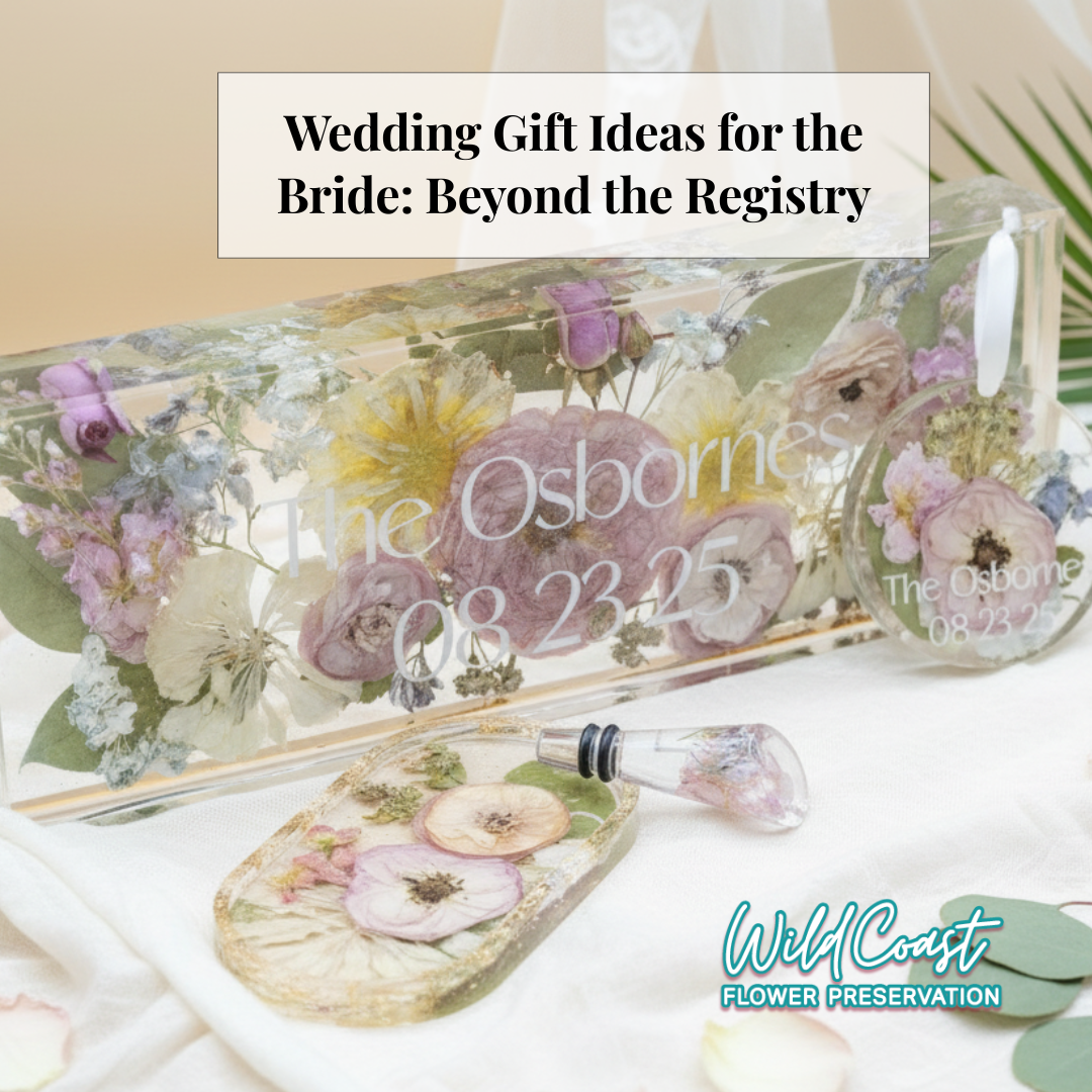 Wedding flowers preserved in a rectangle block, flowers in an oval ring dish, a floral wine stopper and ornament are all gifts beyond the wedding registry