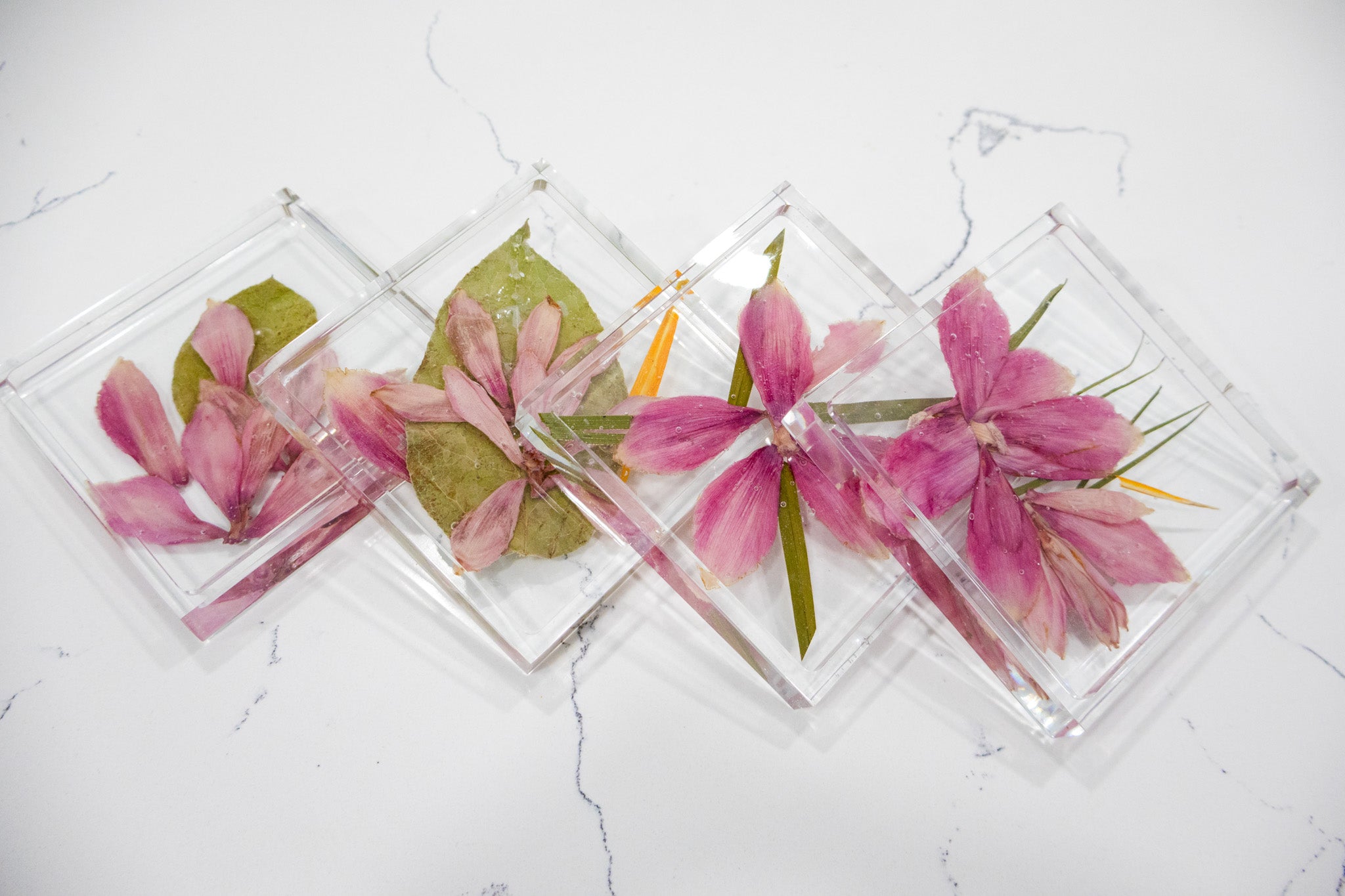 set of 4 square coasters with pressed wedding bouquet of tropical arrangement