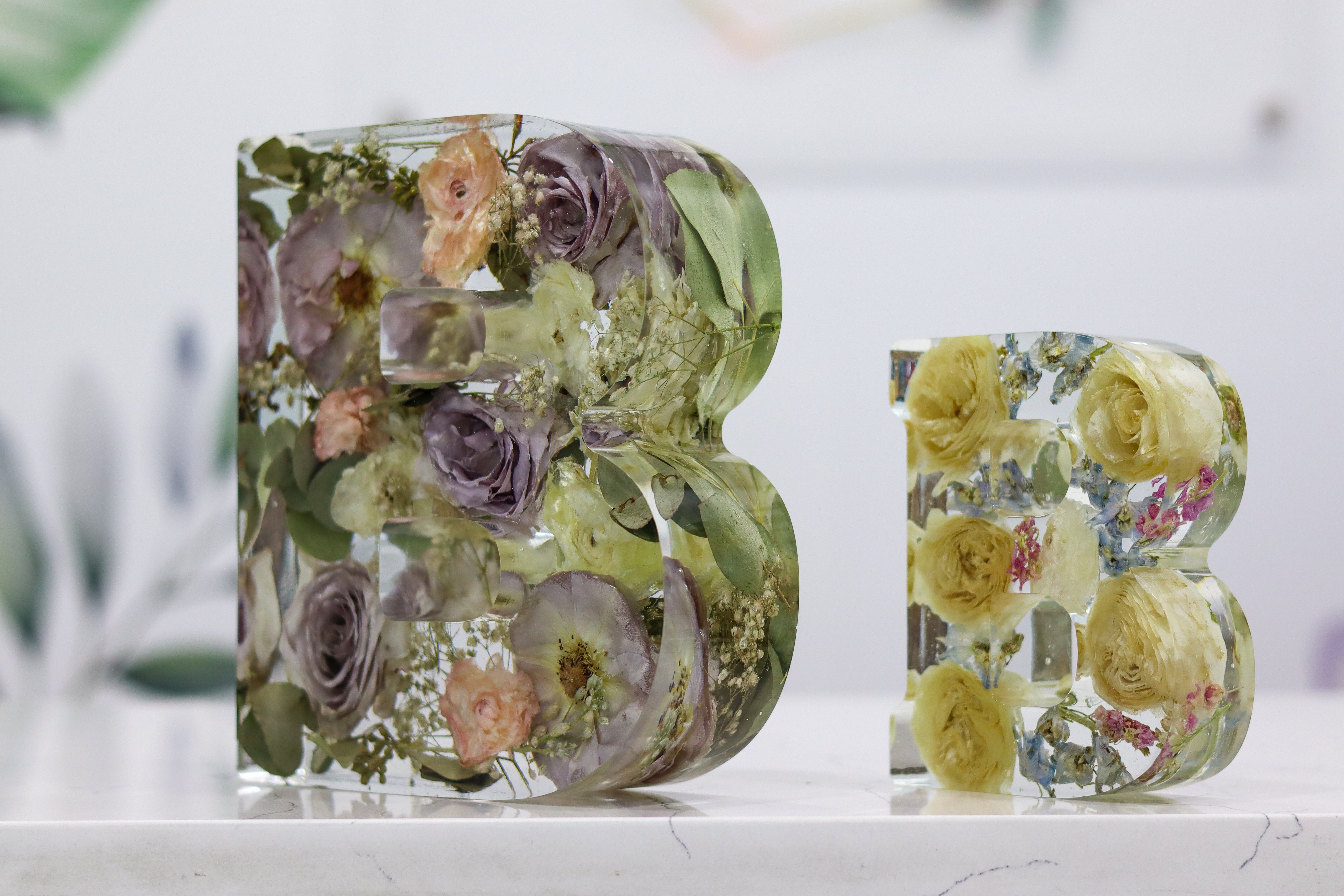 Resin Letter Shape 'B' flower preservation blocks on display to show size difference