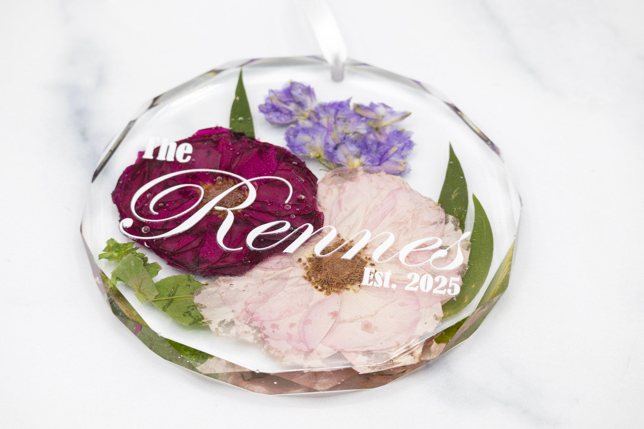 faceted edge ornament crystal ornament with white ribbon and white text