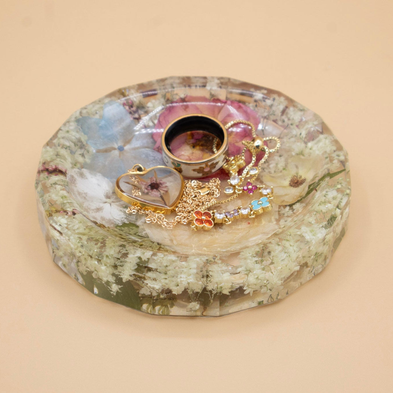 Preserved Flower Ring Tray with dried flowers and pressed bouquet preservation holding jewelry on a beige background
