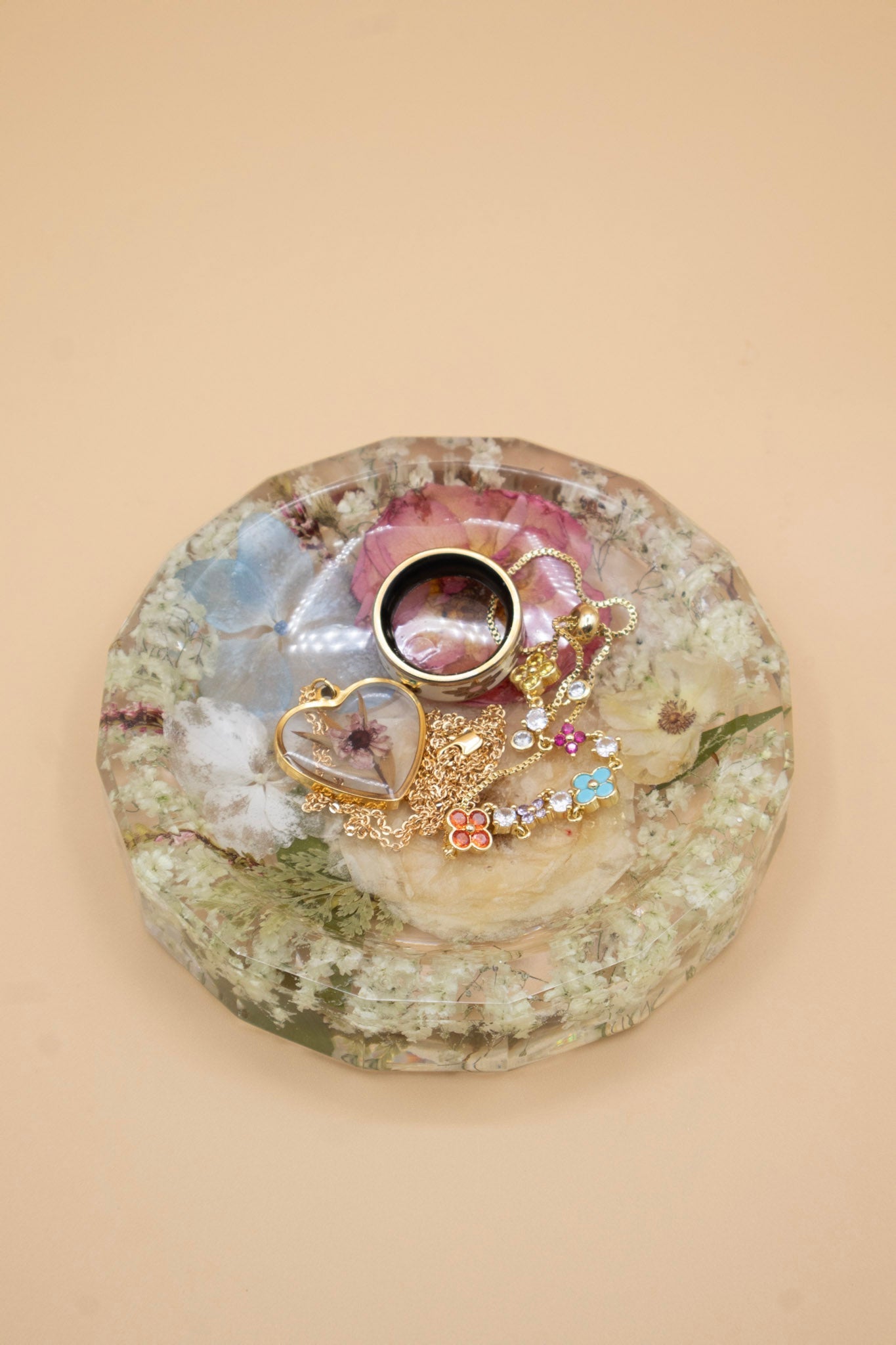 Preserved Flower Ring Tray with pressed bouquet preservation holding jewelry on a beige background