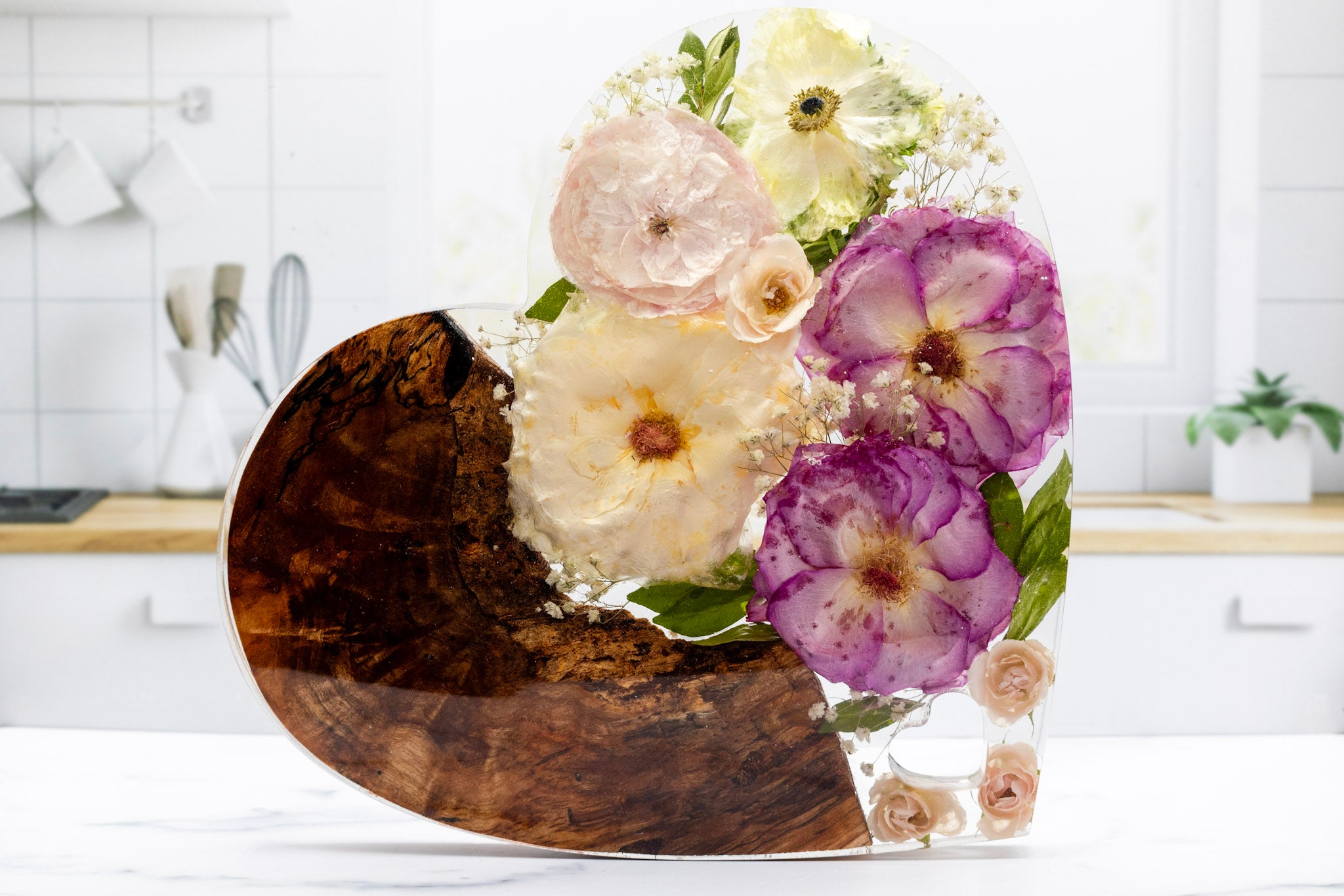 Standing Resin Heart Block with Live Edge Cedar and Preserved Pink and White Wedding Bouquet on a Kitchen Counter