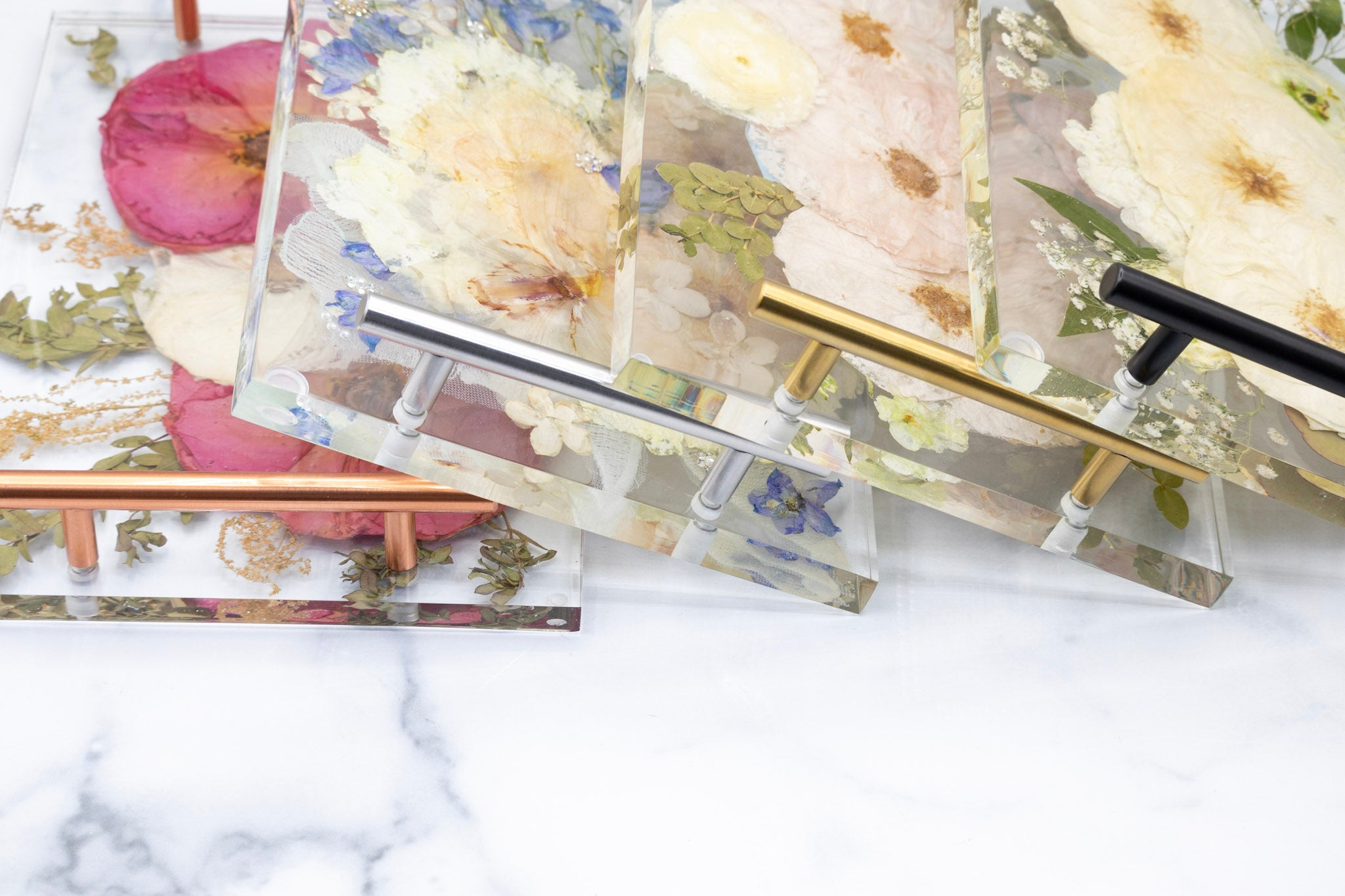 12x8 Tray & Round Coaster Bundle featuring floral designs in resin with elegant metallic handles on a marble surface.