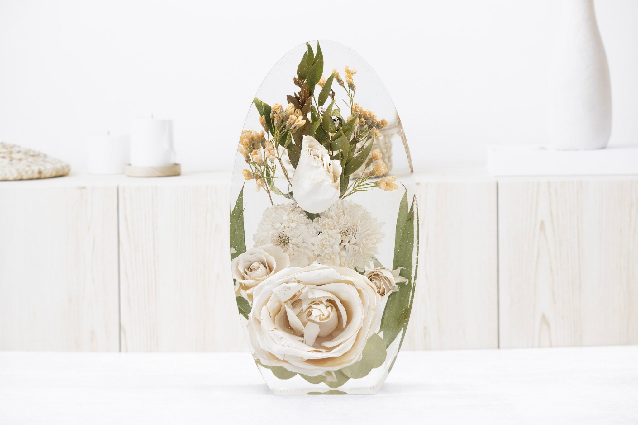 White wedding bouquet preservation with color correction paint service memorial flowers encased in epoxy resin oval shape