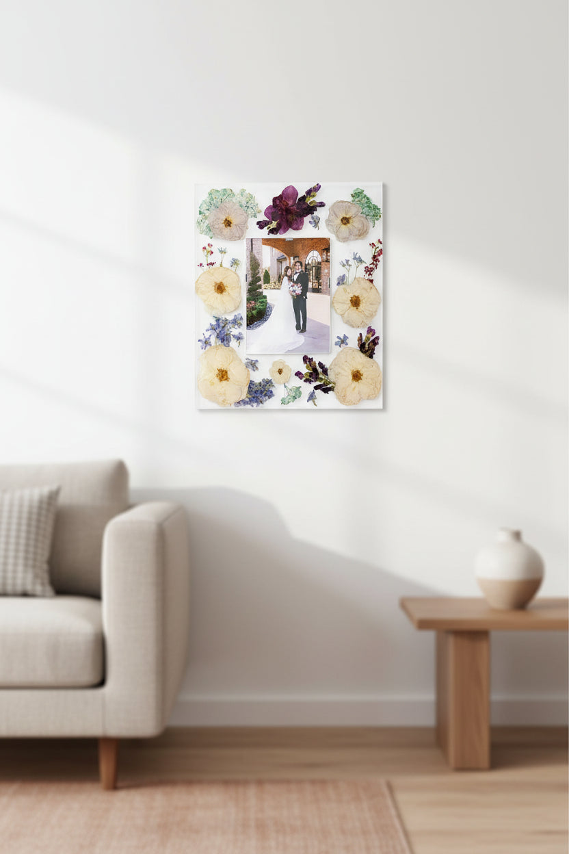Epoxy resin photo frame with pressed wedding flowers and a wedding photo inside. Flower Preservation photo frame.