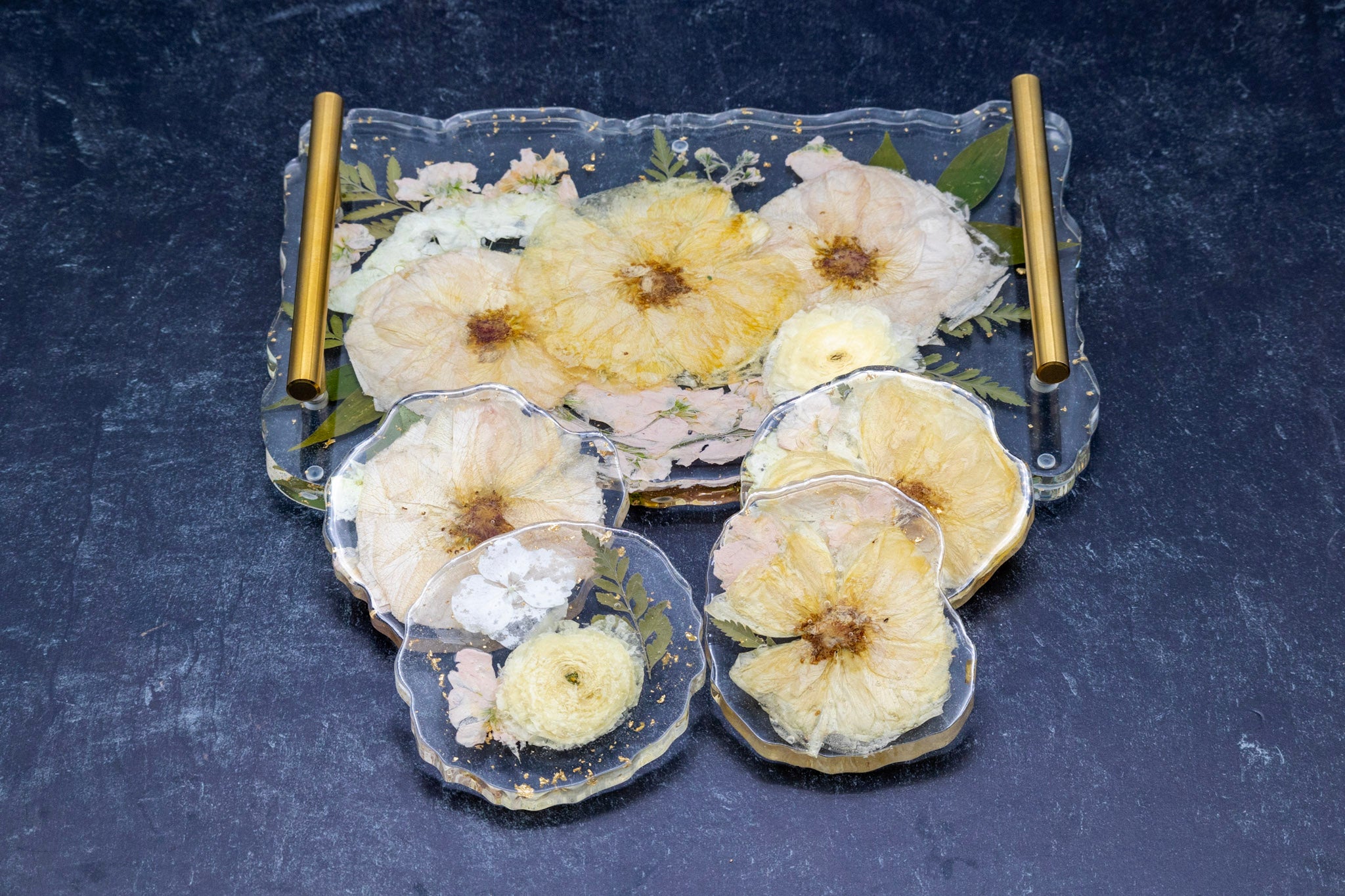 Decorative tray with pressed flowers on a dark surface Pressed Garden Rose Dried Flowers