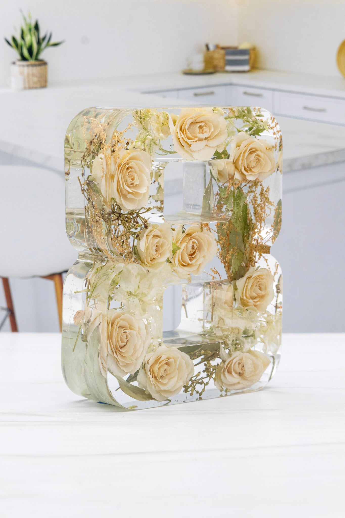 Clear Resin Number 8 with preserved white roses inside