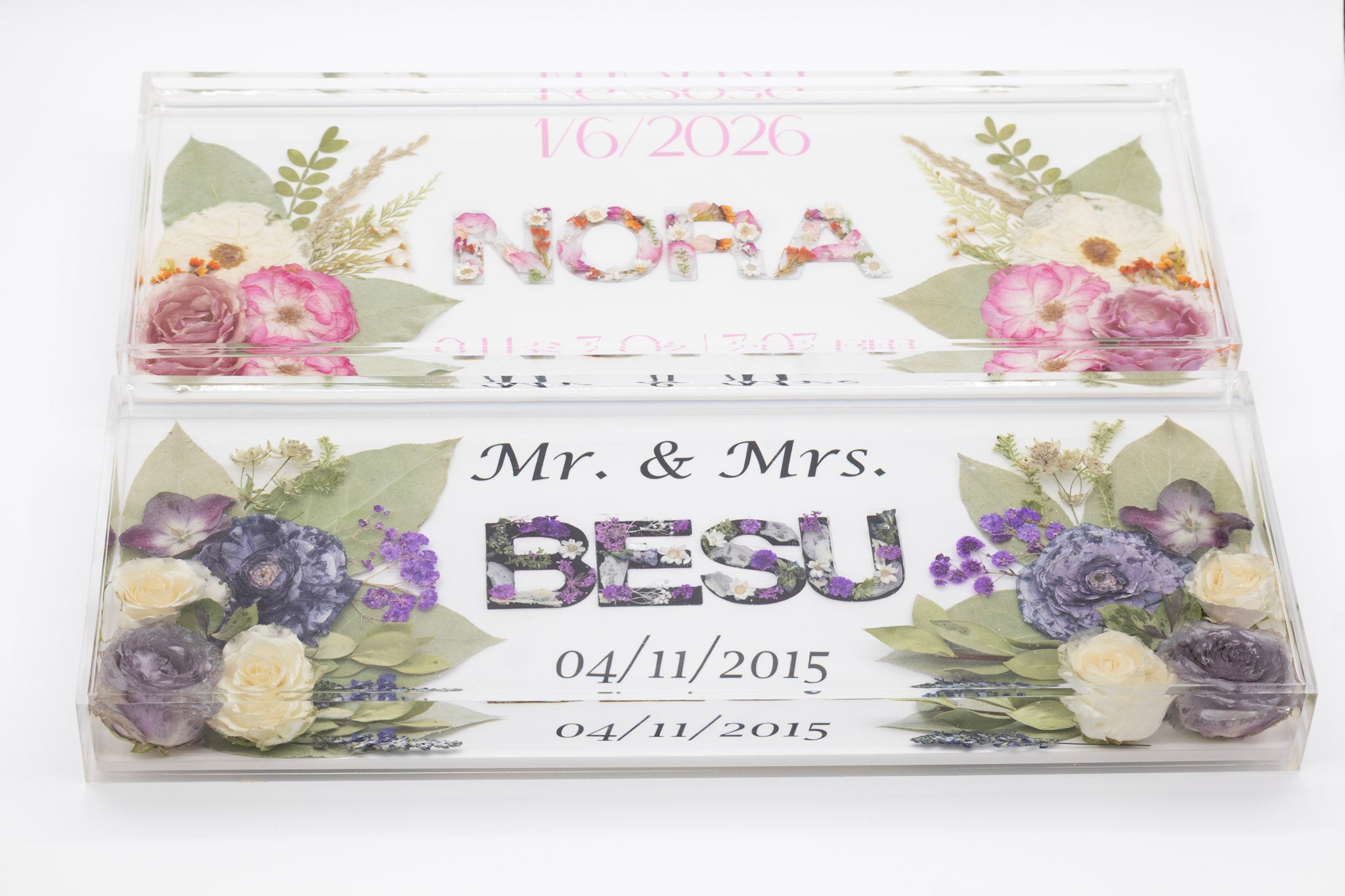 Personalized resin name block with floral resin letters, preserved flowers and text on a white background