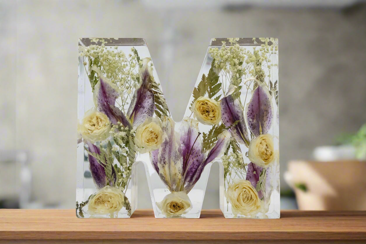 Flower Preservation Lily and Rose Letter M on a wood countertop for room decor