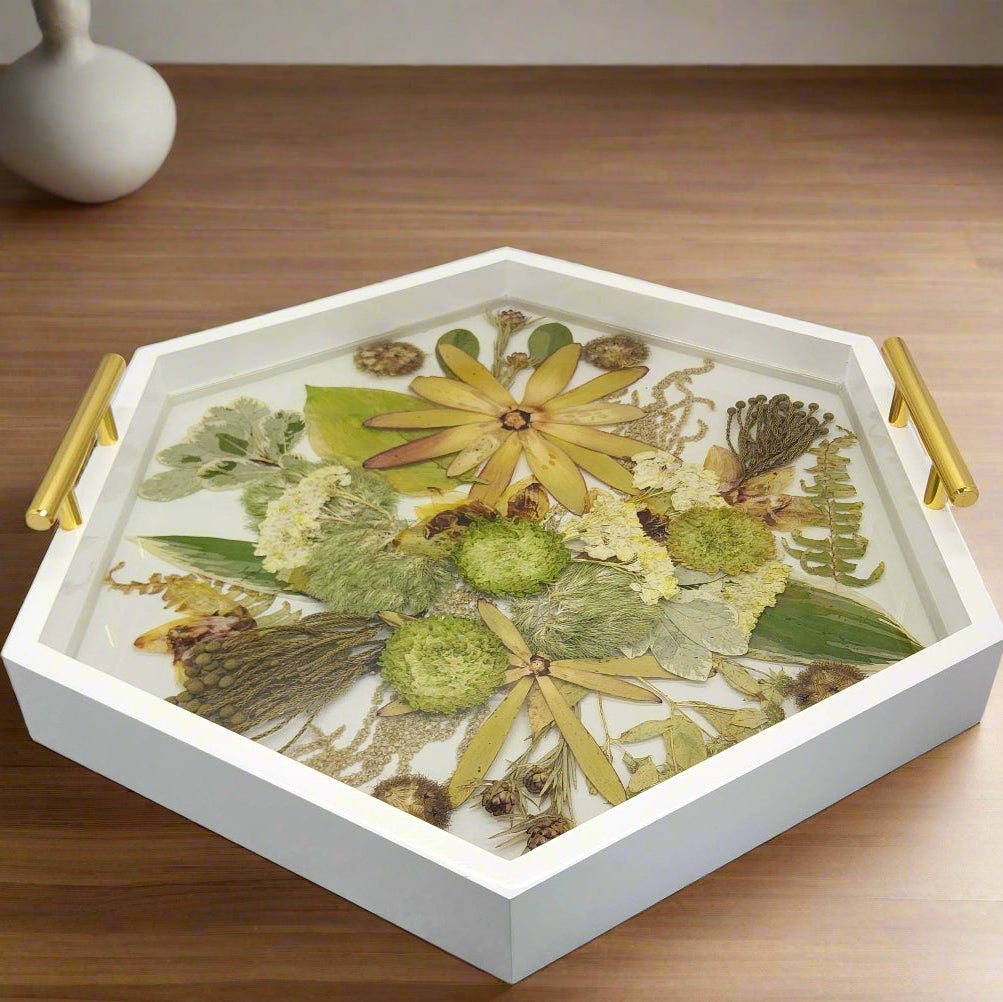 Wedding flower preservation serving tray made of white wood with gold handles featuring a green bouquet preserved inside