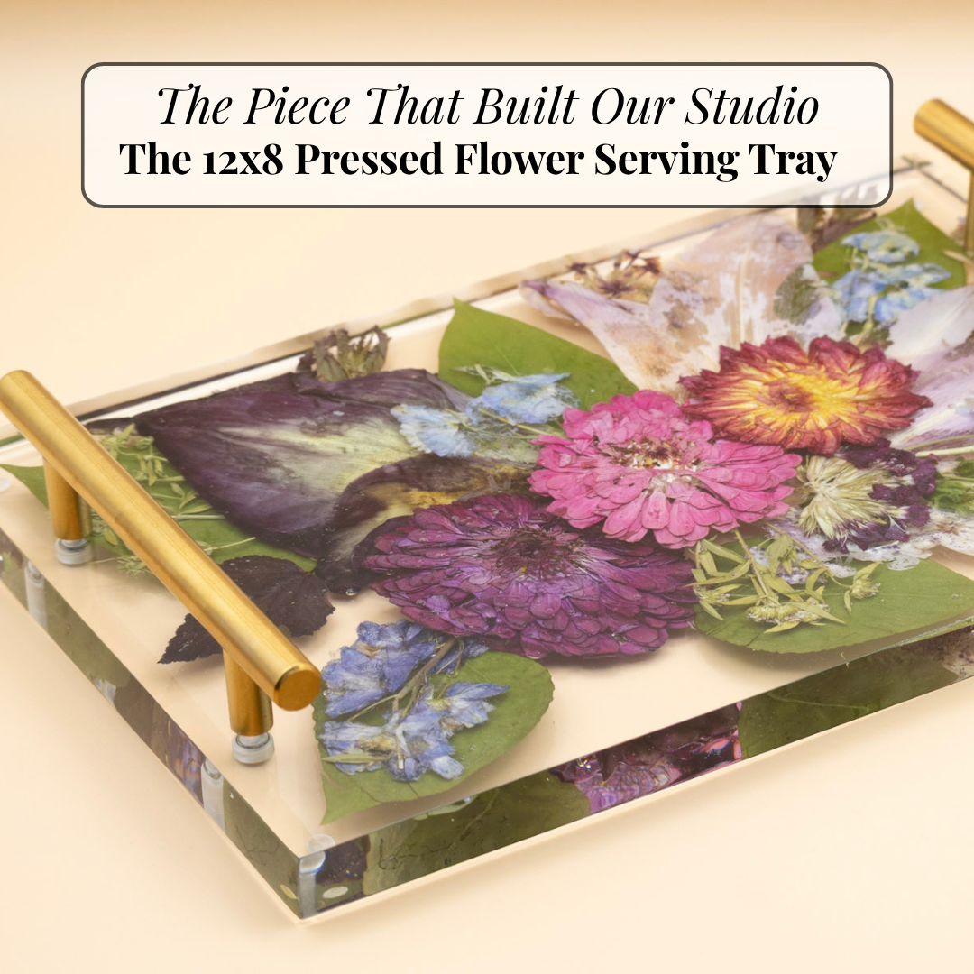 Pressed flower serving tray made showcasing clear resin flower preservation with a colorful bouquet and gold handles on a neutral background with blog topic in black text