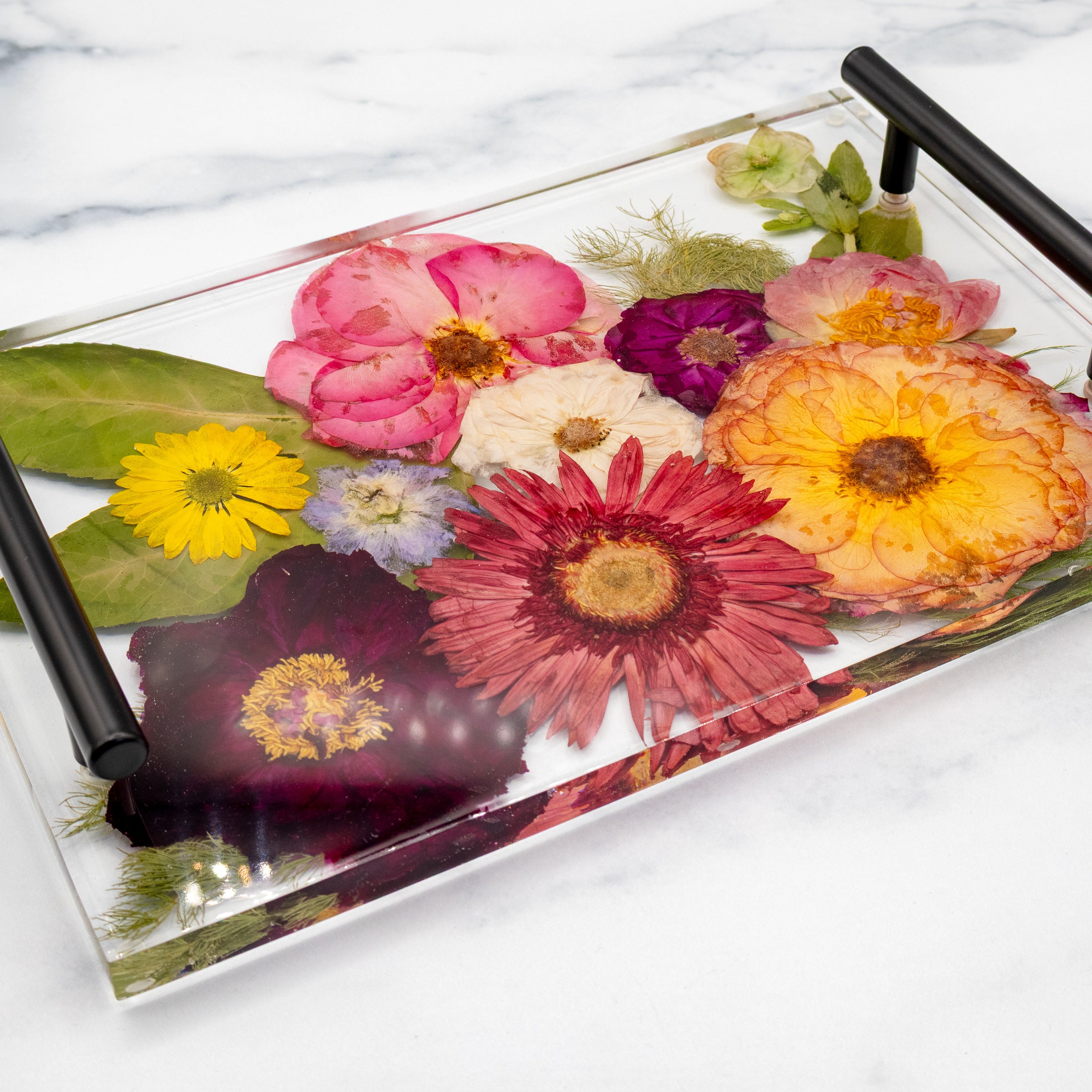 Wedding flower preservation resin flower vanity tray with black handles on a white background