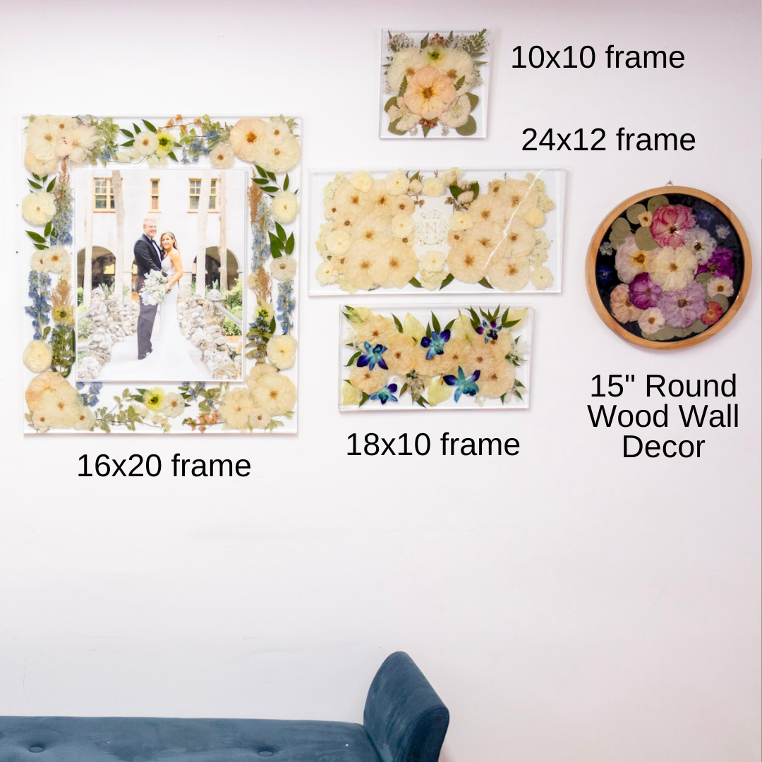 Pressed flower preservation Wall decor items including framed photos and a round wood wall decor with floral elements.