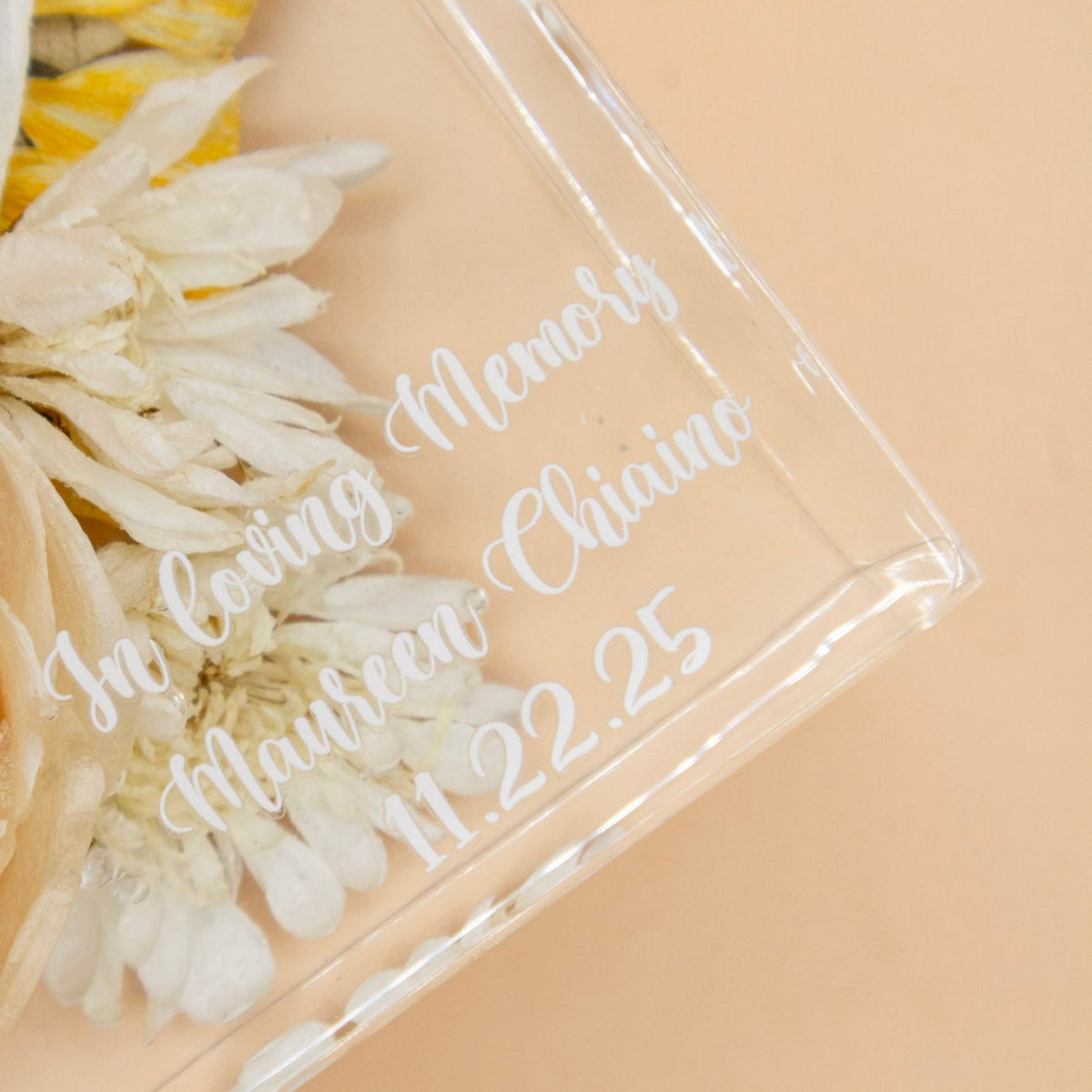 Custom text personalization font c in white on a clear resin block