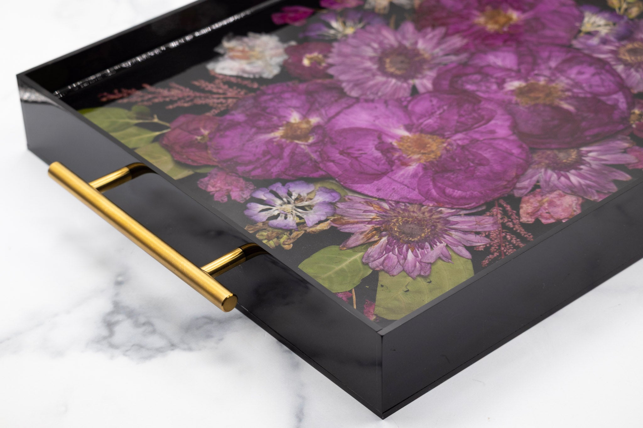 Beautiful purple wedding bouquet preserved in black acrylic resin tray featuring lavender roses and purple blooms, demonstrating elegant bouquet preservation craftsmanship