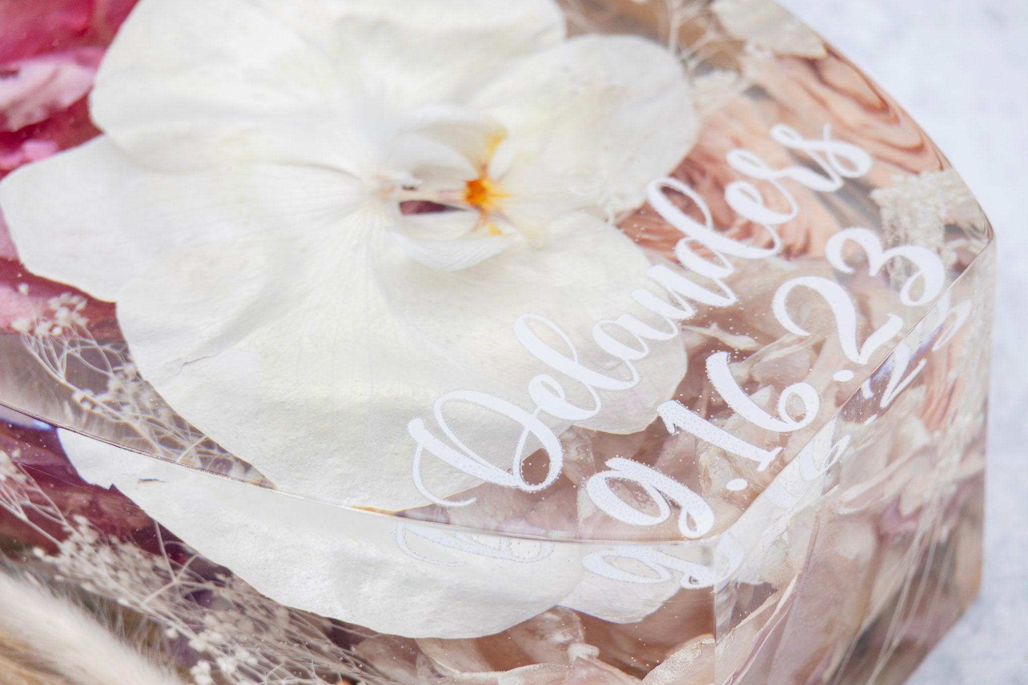 Clear resin block with white orchid and engraved text on dried flower art