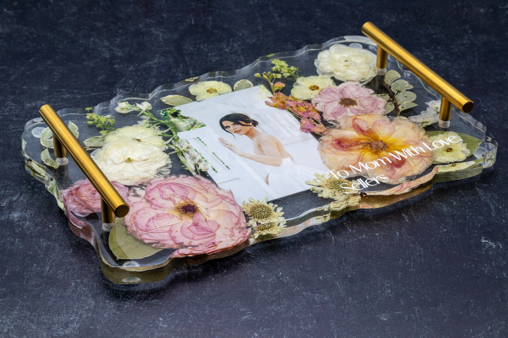 resin wedding bouquet preservation serving tray with gold handles and geode edge displaying an inlaid wedding photo and text personalization for Mom on dark background
