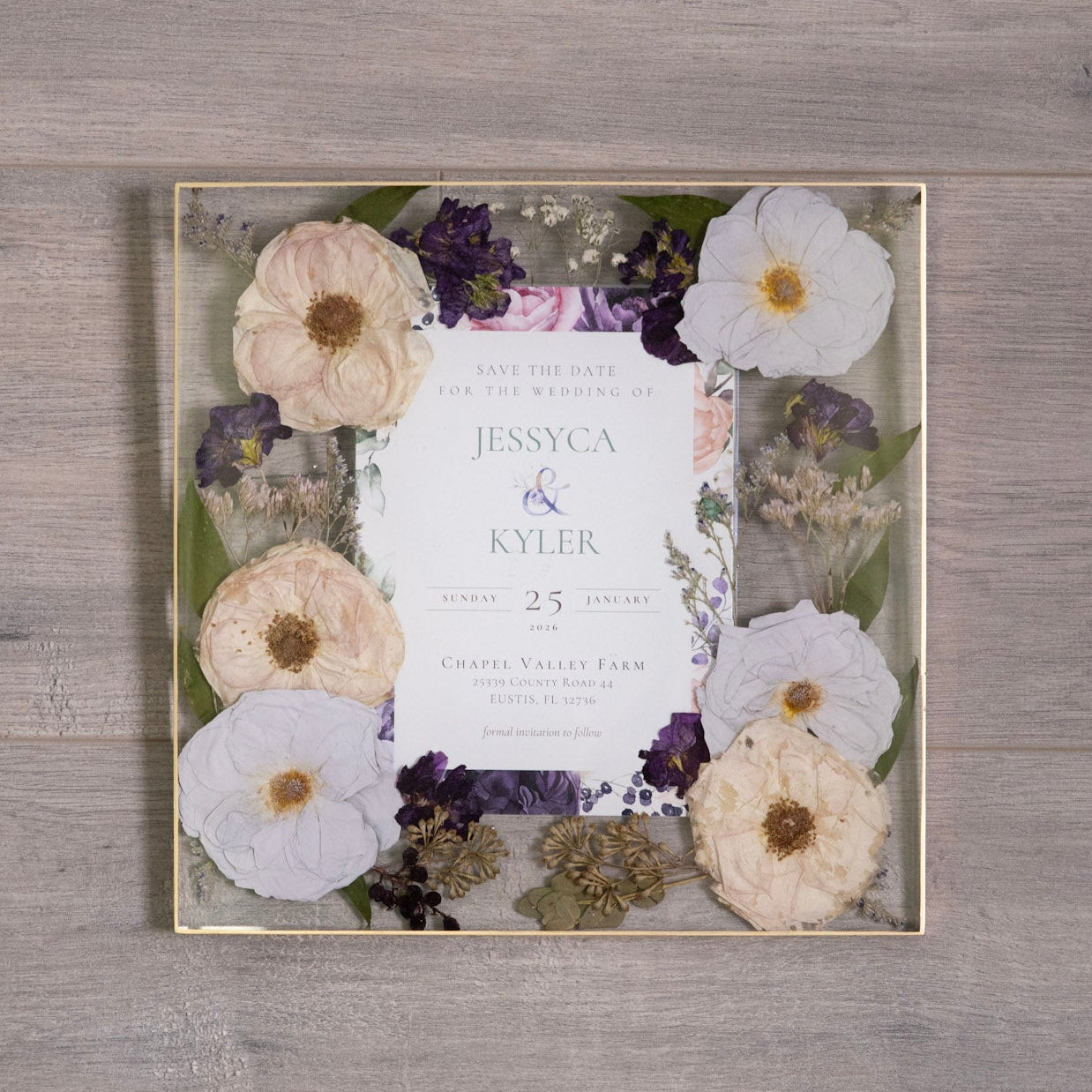 pressed wedding bouquet and invitation preserved in resin wall art keepsake flower preservation wall decor on a wood background