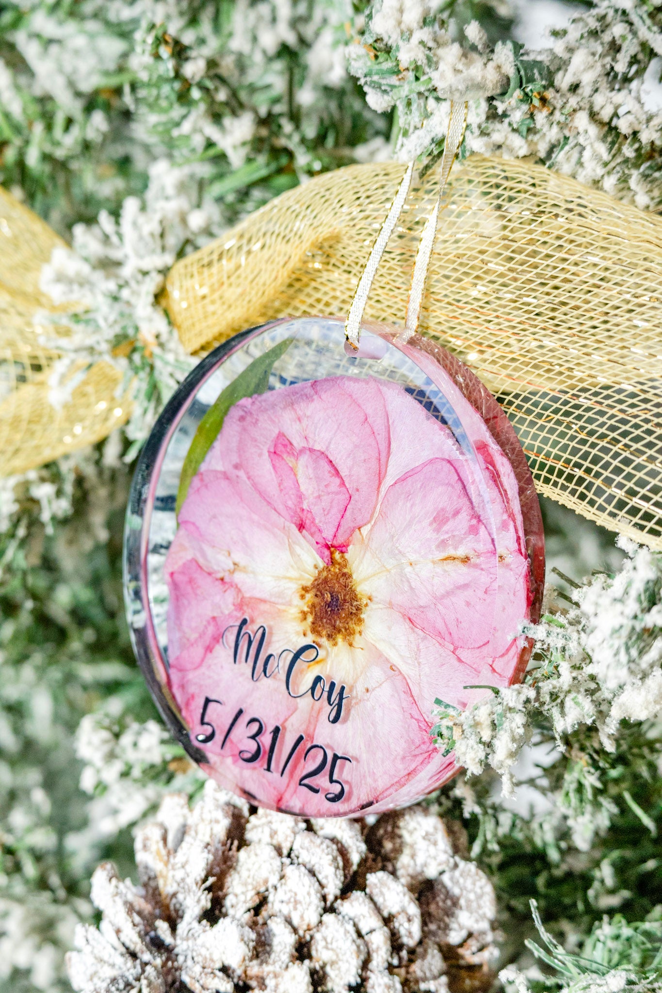 Wedding Flower Ornament with pink pressed rose and text on a Christmas tree.