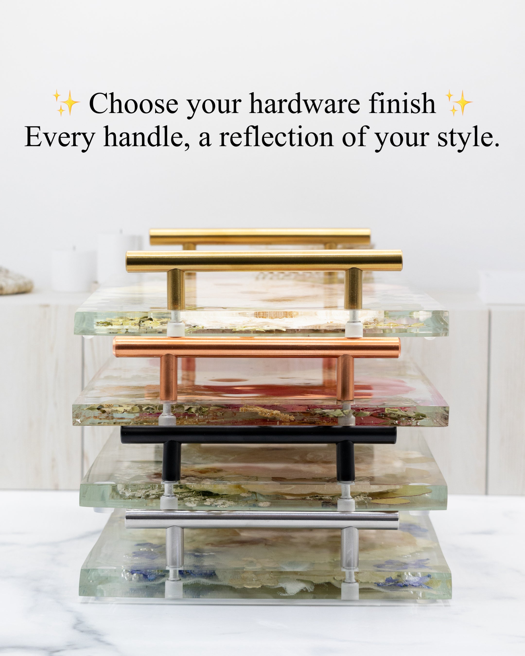 Stack of trays with handles in various finishes on a white background with text about hardware finishes.