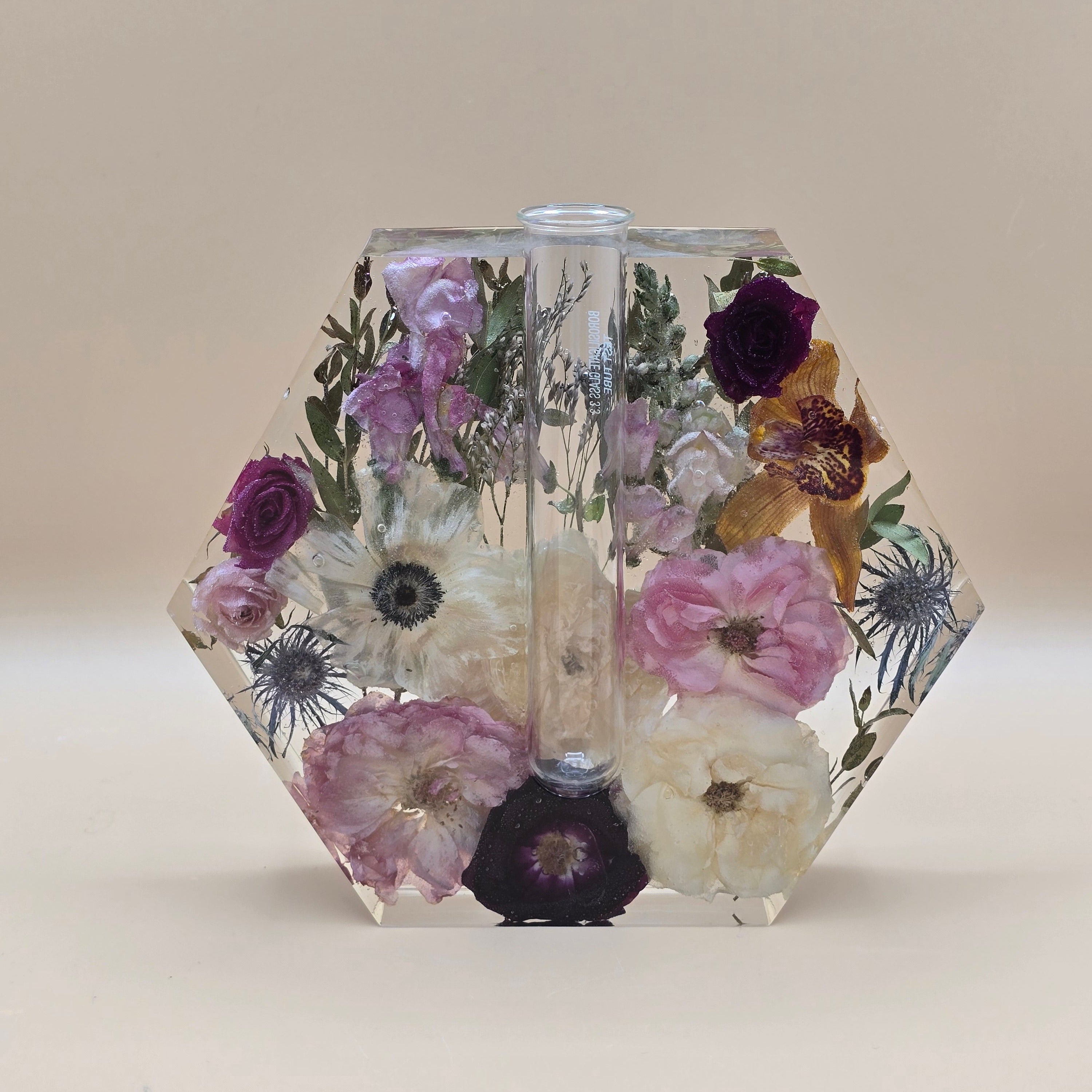 Resin encased flowers in a hexagon-shape with glass tube for propagation flower 