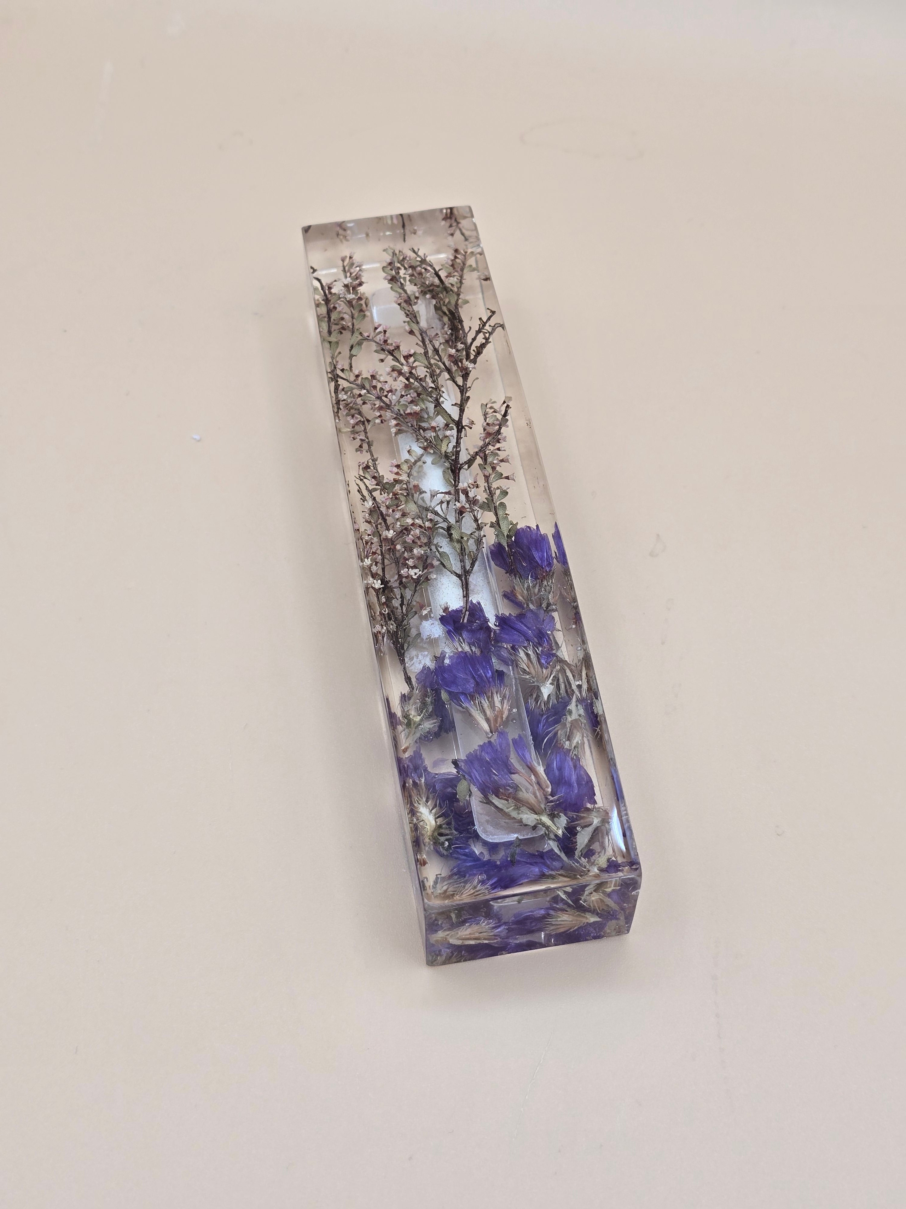 Resin mezuzah case with preserved purple flowers