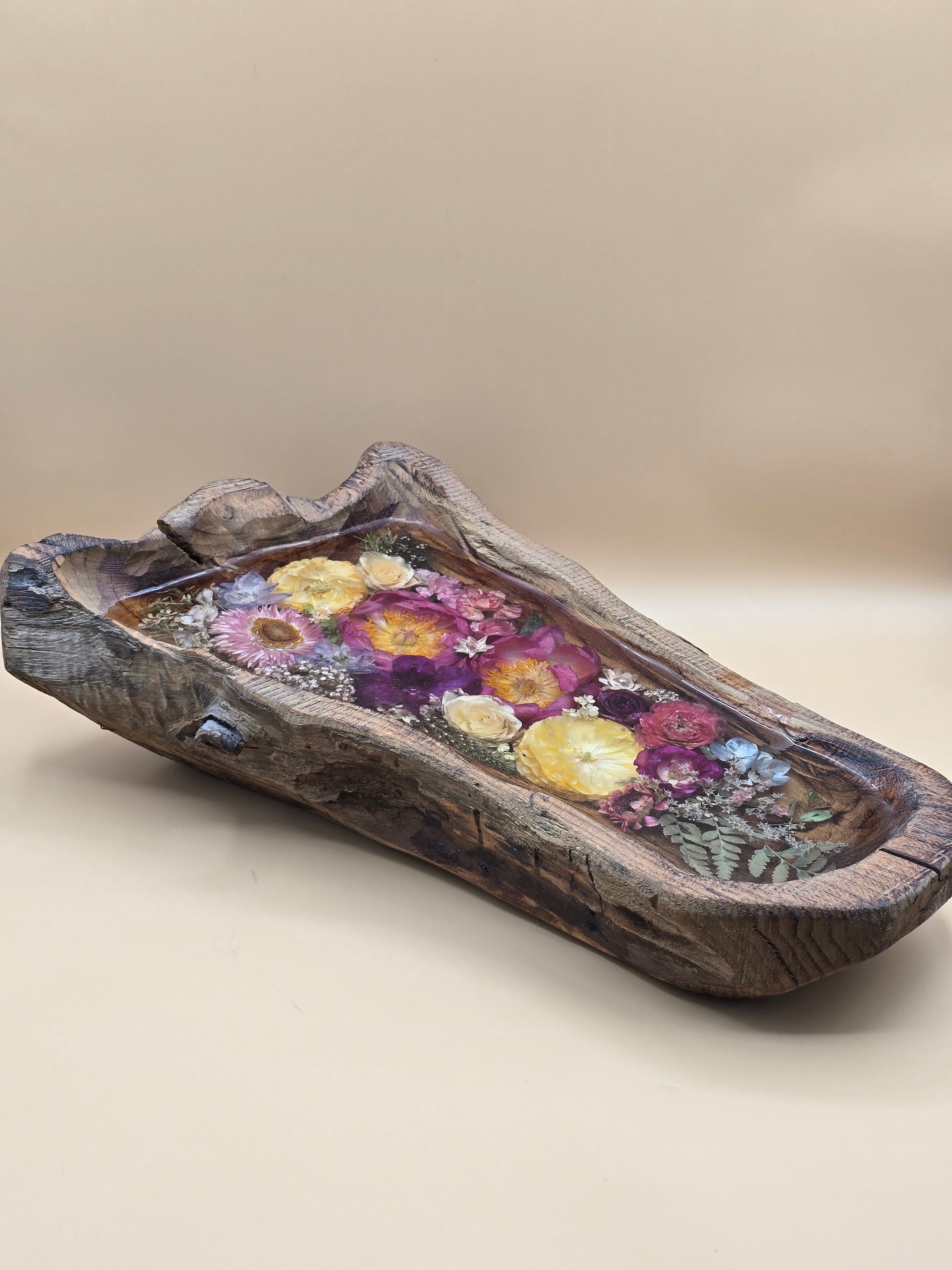 Premade 14.5" x 9" live-edge wood basin filled with crystal-clear resin and preserved flowers, designed as a one-of-a-kind statement centerpiece for serving, styling, or display.