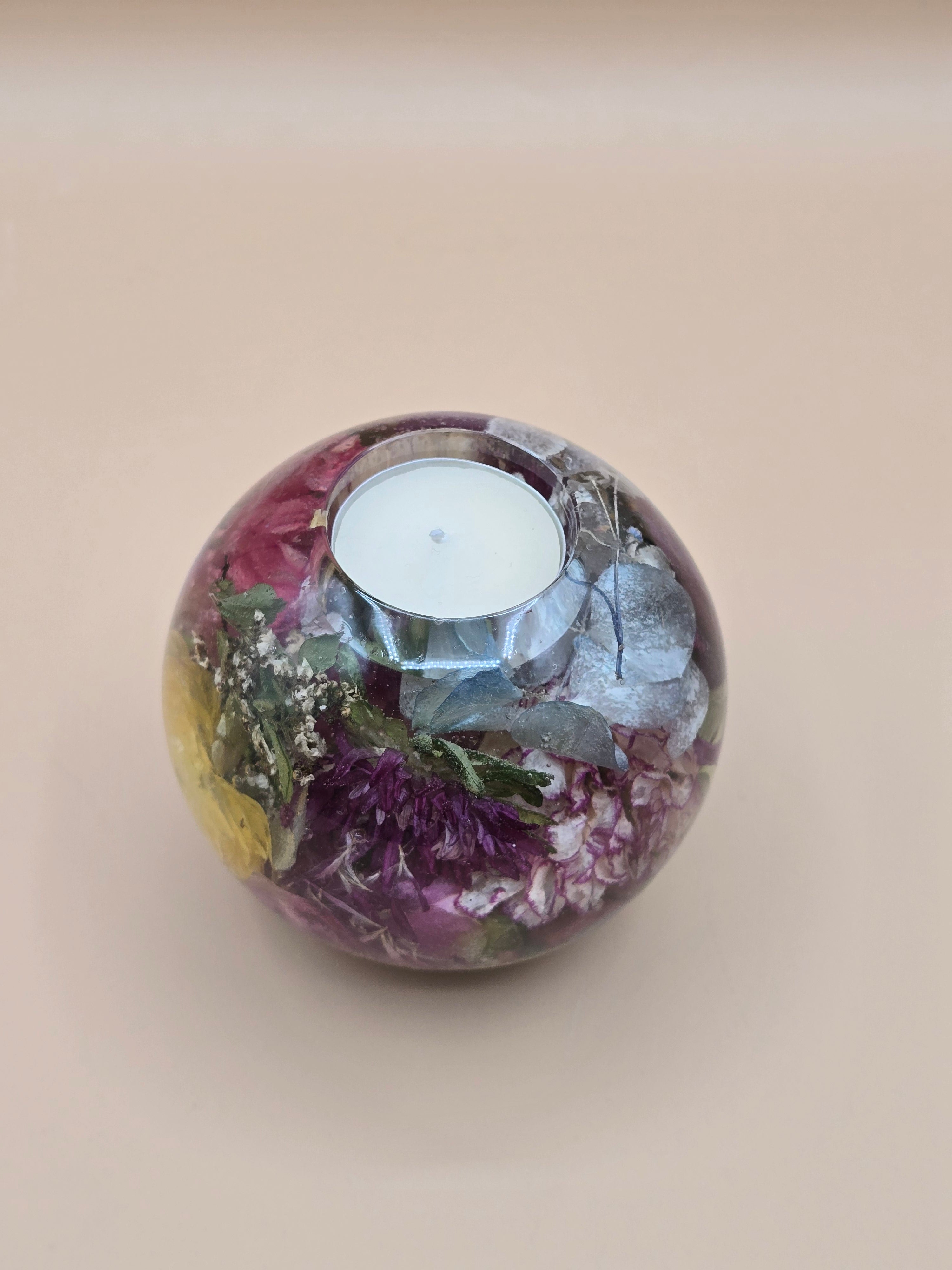 Premade preserved flower tealight sphere candle holder in crystal-clear resin. Ready-to-ship floral centerpiece and preserved flower gift for weddings.